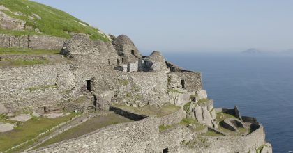 ROK 1080p Still 15 Stone beehive huts on a cliffside—book a Dingle Peninsula tour online to explore this view.