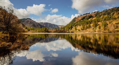 Mountain lake with trees, clouds, and views like a Dingle Peninsula private day tour.