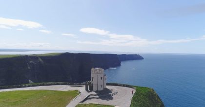 A small stone tower stands on a cliff edge along the Wild Atlantic Way private tour Dingle.